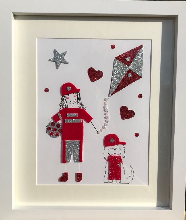 Red football girl with dog and sparkly kite framed wall art